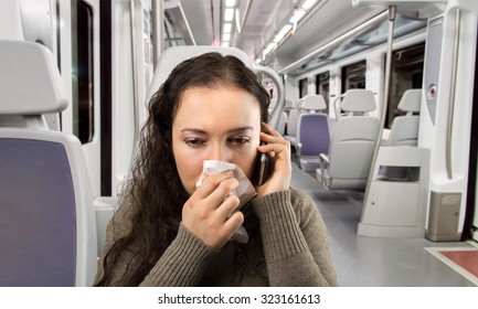 Sick Woman Calling Doctor Urgently At The Train With Smart Phone