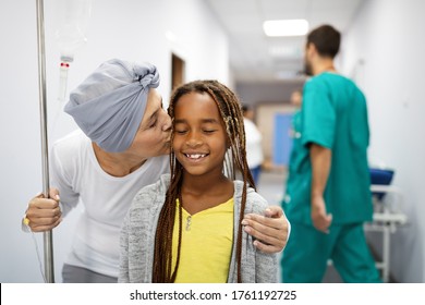 Sick Woman With Cancer Hugging Her Young Grandchild In Hospital. Family Support Concept.