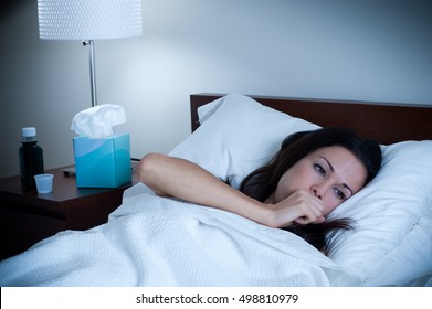 Sick Woman Coughing In Bed