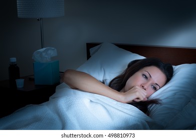 Sick Woman Coughing In Bed In The Middle Of The Night