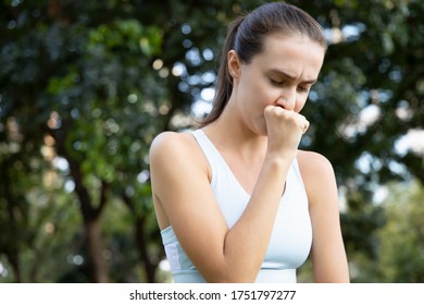 Sick Woman Coughing With Sore Throat; Sick Woman With Cough Symptom, Sore Throat, Cold, Flu, Contagious Disease, Virus Outbreak, Coronavirus, COVID 19, Health Care Concept; Young Adult Woman Model