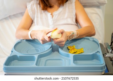 Sick Woman Eating In The Hospital.