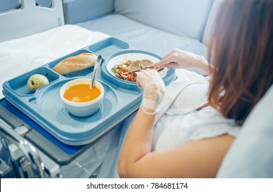 Sick Woman Eating In The Hospital.