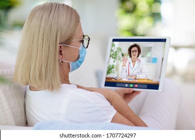 Sick Woman In Face Mask Calling Doctor. Online Video Chat And Conference Call With Hospital Medical Staff. Ill Senior Patient Coughing. Coronavirus Outbreak. Covid-19 Pandemic. Phone Consultation.