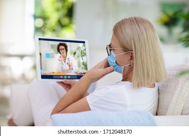 Sick Woman In Face Mask Calling Doctor. Online Video Chat And Conference Call With Hospital Medical Staff. Ill Senior Patient Coughing. Coronavirus Outbreak. Covid-19 Pandemic. Phone Consultation.