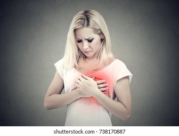 Sick Woman With Heart Attack, Pain, Holding Touching Her Chest Colored In Red With Hands. 