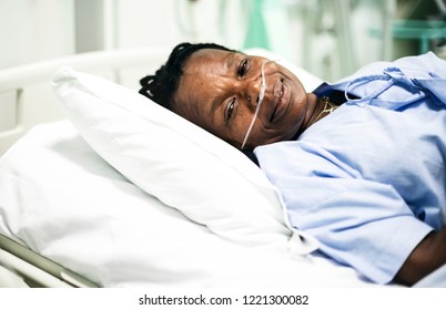 Sick Woman In A Hospital Bed