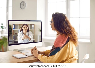 Sick woman listening recommendations and appointment having online video call with a female friendly smiling doctor using pc computer at home. Telemedicine and patient consultation online concept. - Powered by Shutterstock