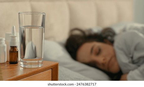 Sick woman lying in bed bedroom home flu coronavirus pandemic virus girl coughing female rest sleep treatment unhealthy disease suffer fever nap bad feeling illness cold contagious infection medical - Powered by Shutterstock