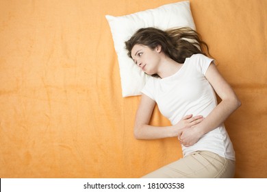 Sick Woman Is Lying On The Bed.