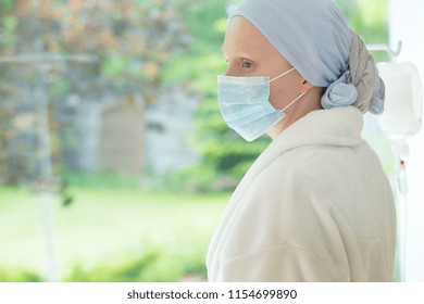 Sick Woman With Mask On Face During Treatment In The Hospice