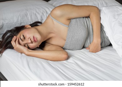 Sick Woman On Bed Concept Of Stomachache, Headache, Hangover, Sleeplessness Or Insomnia