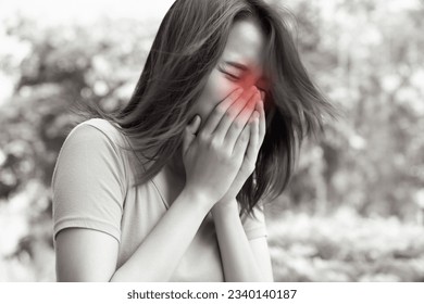 sick woman sneezing with sore throat; sick woman with allergic sneeze symptom, sore throat, cold, flu, contagious virus disease, coronavirus, allergy, health care concept; young asian woman model