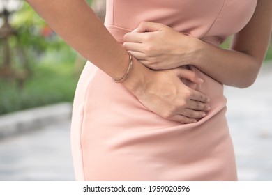 Sick Woman With Stomachache Or Period Cramp, Portrait Of Woman Suffering From Stomach Ache, Period Cramp, Indigestion, Food Poisoning, Flatulence, Colon Cancer, Tumor In Stomach, Digestive Problem