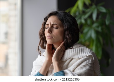 Sick Woman Suffer From Sore Throat Touch Enlarged Lymph Nodes Staying Home On Sick Leave. Unhappy Young Female With Coronavirus Disease, Angina Or Pharyngitis Illness Symptoms. Girl Feeling Discomfort