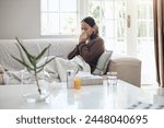 Sick woman, tissue and blowing nose with flu, cold or illness on living room sofa at home. Young female person with medication for sneeze, fever or influenza from infection on lounge couch at house