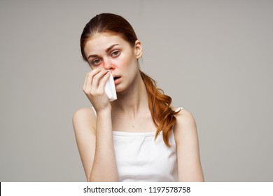 Sick Woman Wipes A Red Nose With A Handkerchief                        