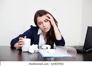 Sick Woman At Work Drinking Coffee