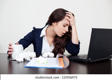 Sick Woman At Work With Headache