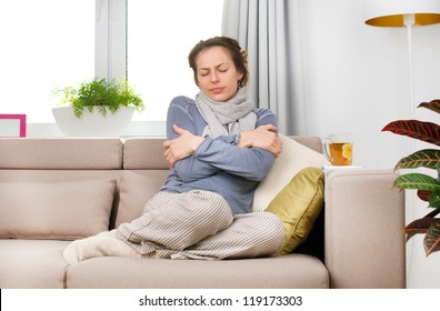 Sick Woman.Flu.Woman Caught Cold. Sitting on the Sofa. Headache. Virus