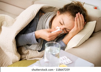 Sick Woman.Flu.Woman Caught Cold. Sneezing into Tissue. Headache. Virus .Medicines