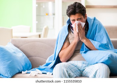 Sick Young Man Suffering From Flu At Home