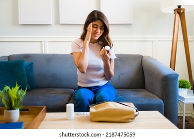 Sick Young Woman With A Bad Headache Or Migraine Taking Medicine Pills And Medical Treatment