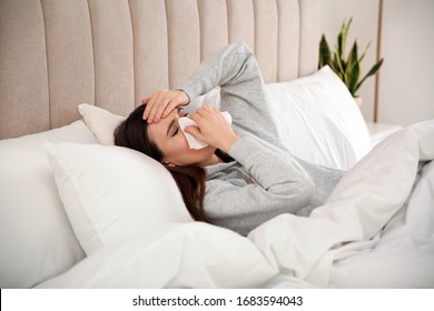 Sick Young Woman In Bed At Home. Influenza Virus