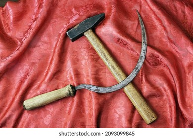 Sickle and hammer on rich red shawl - Shutterstock ID 2093099845