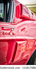 The Side Air Scoops Of A Sixties American Sports Car In Red.