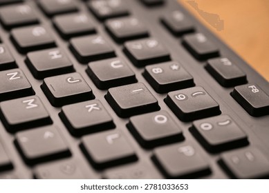 Side Angled Top View Macro Close-Up Black Computer Keyboard Highlighting I Key with Soft Blurred Tech Backgrounds