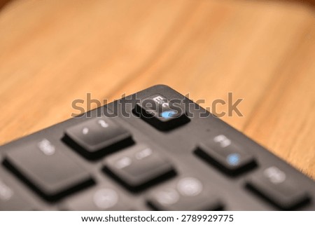 Side Angled Top View Macro Close-Up Black Computer Keyboard Highlighting Esc Key on Blurred Tech Backgrounds