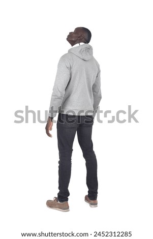 side back view of a man standing and look up on white background
