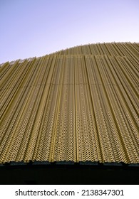 side of building looking along the texture of metal and lights