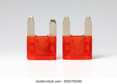 Side by side comparison of broken or blown vehicle blade fuse and new blade fuse. Isolated on white background.  Concept of automobile electrical repair, service and maintenance