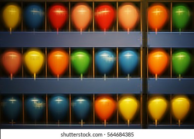 Side by side and superimposed balloons of a shooting gallery at a fair / Shoot balloons            