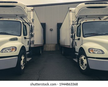 Side By Side Trucks In The Loading Bay