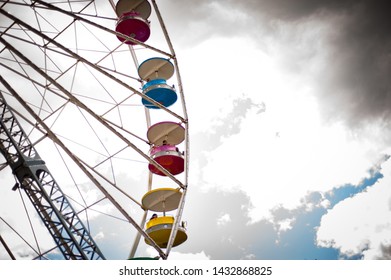 Side Of Colorful Ferris Wheel Day Time Blue Sky Clouds Sunny Amusement Theme Park