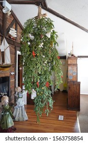 Up side down, Christmas tree, hanging from the ceiling with rope, with simple rural decorations, Bavarian style restaurant, Eastern Shore Winter Festival, Nova Scotia, Canada