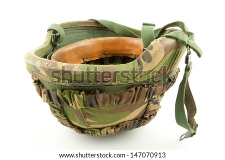 A up side down helmet of a soldier with Dutch woodland camouflage