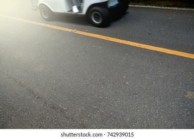 Side Of Golf Cart And Light On The Road