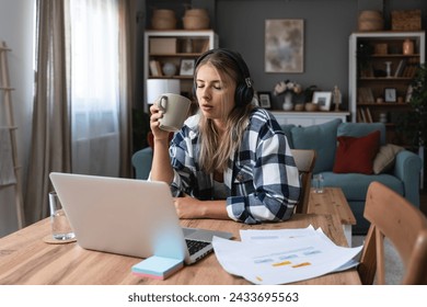 Side hustle money, second job concept. Young university student woman working freelance internet online job to pay student loan, saving money for rent, travel vacation Finance and economy video call