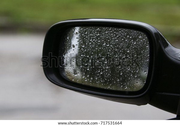 the side mirror of a car
in the rain