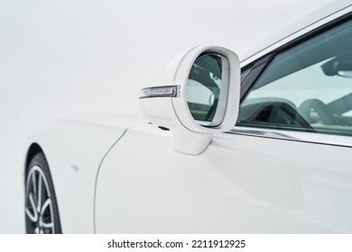  Side mirror on a white lucury sportcar close up             