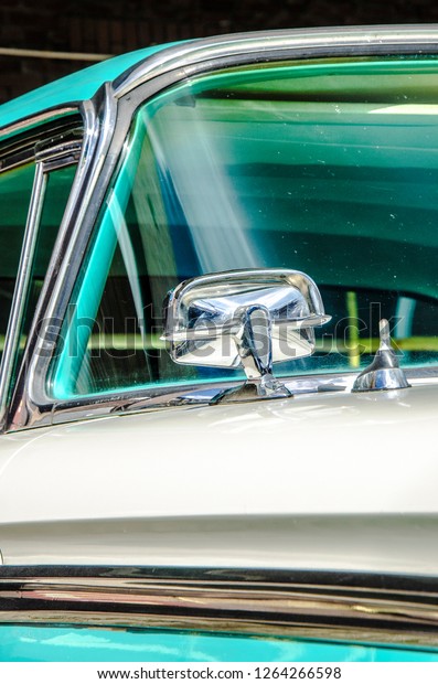 Side mirror of a vintage\
American car