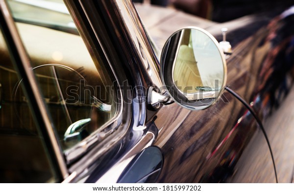side\
mirror of a vintage car, vintage mirror of a\
car