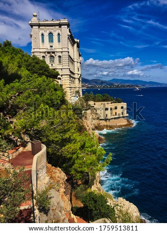 Side of Oceanographic Museum of Monaco in Monte Carlo with Turquoise Ocean Water and Green Tree. Marine Institut in Monaco.