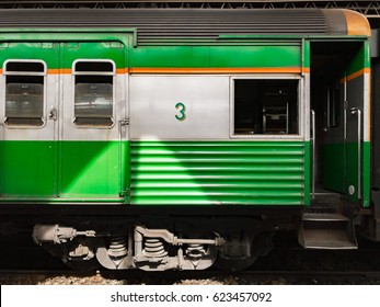 The Side Of The Old Green Train At The Bangkok Railway Station.