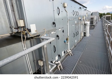 Side part of the air handling unit on the roof with a footprint. - Shutterstock ID 2239042591