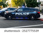 Side of a police car with blue lights